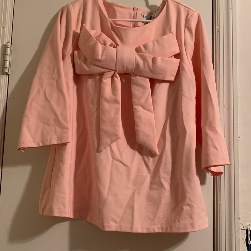 Dainty Jewell’s pink bow top